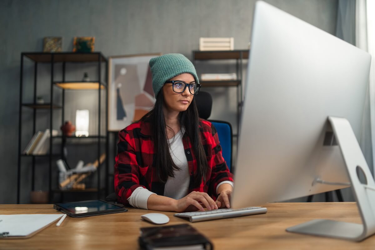 Female video editor works indoors in creative office studio. Placeholder image