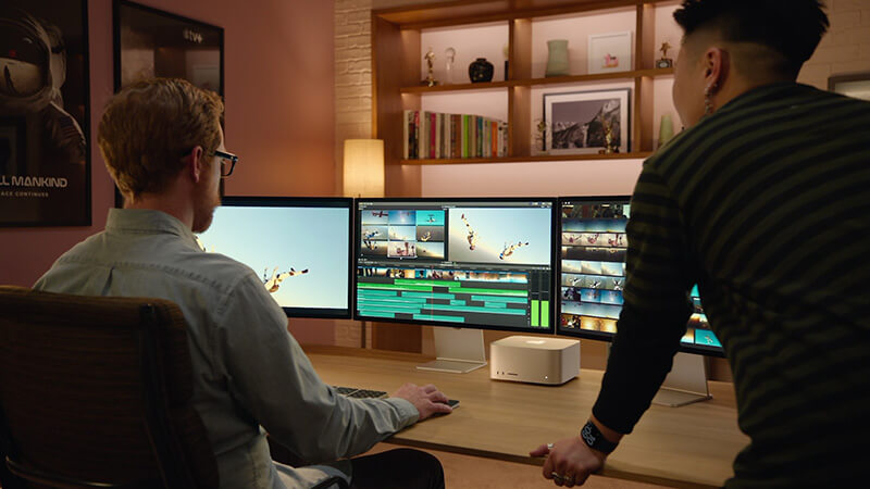 mac studio_multiple_displays Two editors review a timeline over three monitors attached to a mac studio